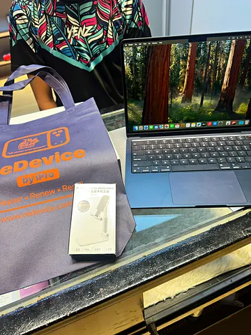 MacBook, accessory box and ReDevice bag on the counter